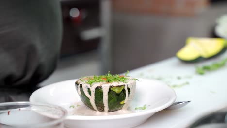 Pumpkin-zucchini-recipe-at-mexican-restaurant-adding-salt-and-coriander-by-latin-chef-at-restaurant
