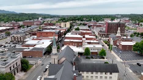 Slow-Aerial-Push-in-to-Johnson-City-Tennessee-over-churches,-small-town-america,-hometown-usa,-bible-belt