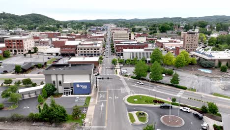 Bristol-Tennessee,-Virginia-aerial-push-over-sign-into-town