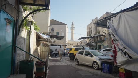 Old-town-street-market-and-White-Mosque-in-POV-tilt,-Nazareth,-Israel