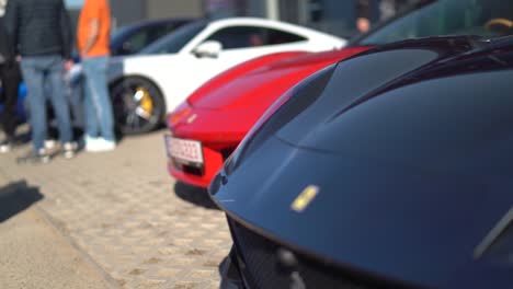 Focus-pull-from-black-Ferrari-to-red-Ferrari