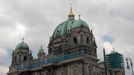 View-Looking-At-Top-Of-Berlin-Cathedral-With-Scaffolding-For-Repair-Works-On-Partly-Cloudy-Day