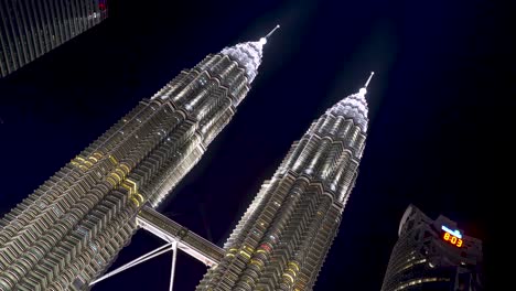 Fast-TV-establishing-shot-over-Petronas-Twin-Towers-at-night-with-water-show