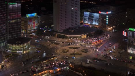 Timelapse-shot-of-a-busy-night-street-and-roundabout-in-the-centre-of-Warszava