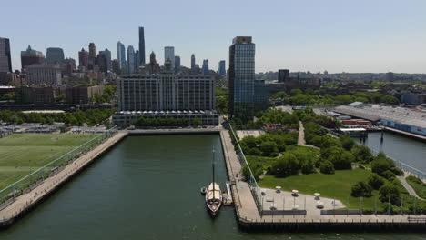 Aerial-view-over-the-Pilot-restaurant-ship-docked-at-Brooklyn-Bridge-Park-Pier-6,-in-sunny-New-York,-USA