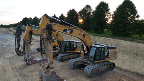 Aerial-rising-shot-of-CAT-excavators-on-job-site