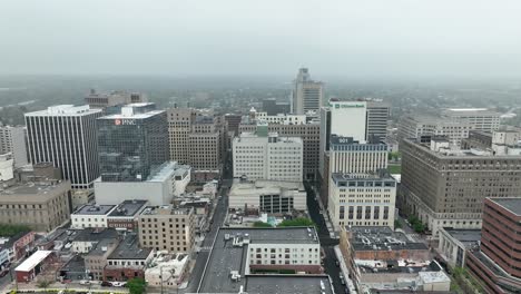 Aerial-truck-shot-of-Wilmington,-Delaware-on-foggy-day-in-spring