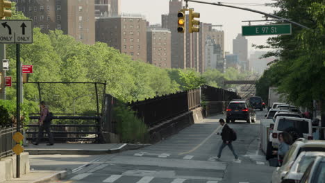 Pedestrians-Cross-New-York-City-Street-On-Warm-Summer-Morning