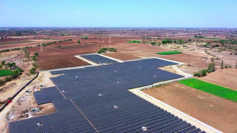 A-huge-solar-power-station-where-green-energy-is-being-produced-is-being-followed-by-an-aerial-camera