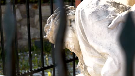 Statue-of-Jesus-falling-under-the-cross,-station-of-the-Cross-in-Gietrzwałd