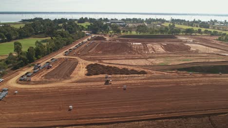 Yarrawonga,-Victoria,-Australia---2-June-2023:-Tracked-forklift-carrying-a-concrete-pit-along-the-earthworks-at-Black-Bull-Golf-Course-in-Yarrawonga-Victoria