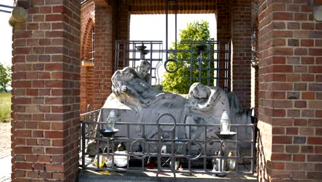 Figure-of-Jesus-Christ-lying-in-the-tomb,-Stations-of-the-Cross-in-Gietrzwałd