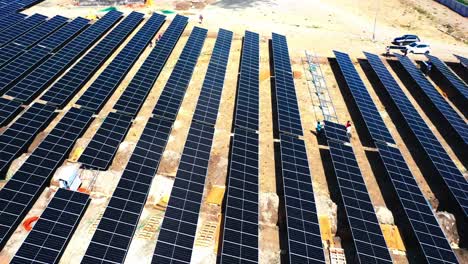 Many-laborers-are-fitting-solar-modules-to-aerial-cameras-that-are-moving-round-shot-of-hyper-lapses-and-time-lapse