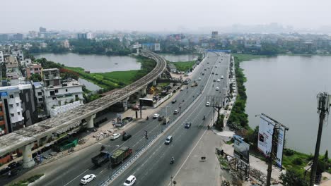 Wide-aerial-shot-of-Kolkata's-skyline-with-highways-and-Nalban-fishery