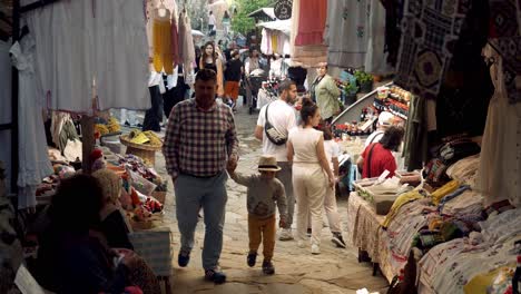 Busy-shopping-scene-in-Turkish-mountain-village-with-cobblestone-street-market