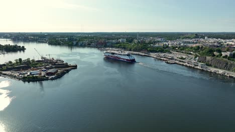 Viking-Lines-cruise-ferry-departing-Stockholm-and-heading-for-Mariehamn-before-Finland-and-Estland---Aerial-with-strong-backlight