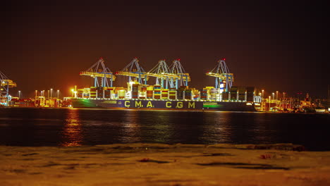 Port-terminal-operations-in-the-Bay-of-Marsaxlokk-in-Ghar-ir-Rih,-Malta-at-nighttime---time-lapse