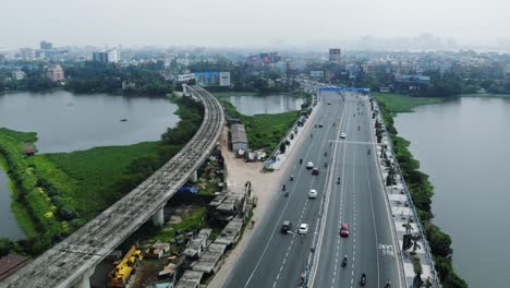 Aerial-view-of-highway-of-Kolkata-near-Chingrihata-flyover-and-Captain-bhery-water-bodies