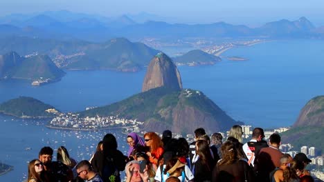 Tourists-clicking-photographs-at-the-Christ-platform-lookout-overlooking-the-Sugar-Loaf-Mountain-and-landscape