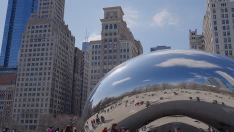 Chicago,-USA---15-march-2023:-Tourists-at-the-famous-landmark-called-Cloud-Gate,-also-known-as-"the-bean",-4k,-pan-movement