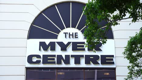 Close-up-shot-of-Myer-logo-on-the-building-exterior,-Australian-retail-giant-will-be-relocating-its-flagship-department-store-after-35-years-of-operation-in-the-namesake-shopping-centre-in-Brisbane