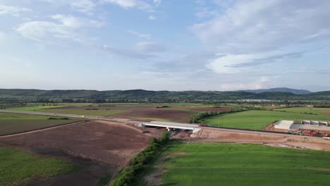 Aerial-view-of-highway-bridge-construction-in-Transylvania-countryside,-Suplacu-de-Barcau,-Nusfalau,-Romania