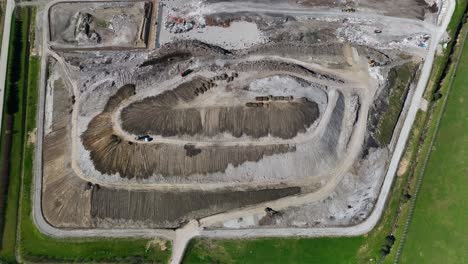 aerial-view,-the-city-landfill,-where-various-debris-and-waste-are-dumped-and-buried