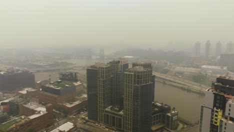 Aerial-view-over-the-Arches-condos,-toward-the-Randalls-Island-and-Brooklyn,-Poor-visibility-in-New-York,-USA