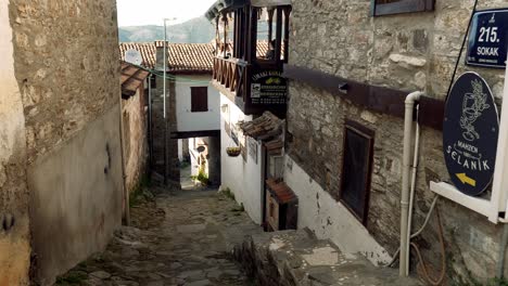 Rustic-cobbled-lane-with-stone-houses-in-pretty-mountain-village-Sirince