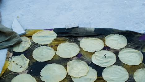 Close-us-scene-with-lots-of-papadam-drying-on-the-terrace-which-is-very-tasty