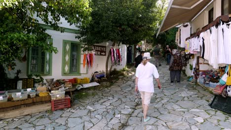 Cobbled-paved-street-scene-in-Turkish-village-with-local-crafts-and-souvenirs