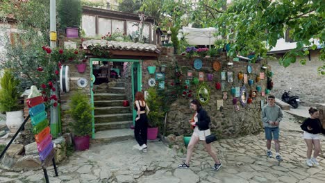 People-enter-into-walled-restaurant-from-quaint-cobbled-streets-of-Sirince