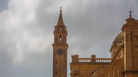 Church-tower-of-the-Basilica-of-the-National-Shrine-of-the-Blessed-Virgin-of-Ta'-Pinu---time-lapse