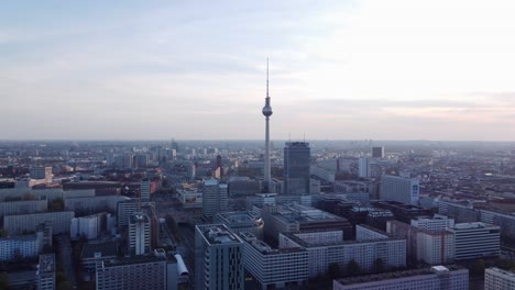 Berlin-skyline-view-with-iconic-TV-tower-Berliner-Fernsehturm,-sunset-aerial-arc