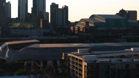Aerial-telephoto-shot-of-the-Shell-Energy-stadium-with-the-Minute-maid-Park-and-Houston-skyline-background
