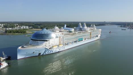 Worlds-largest-cruise-ship-ICON-OF-THE-SEAS-departing-for-sea-trials-from-Meyer-Turku-assisted-by-tug-boats