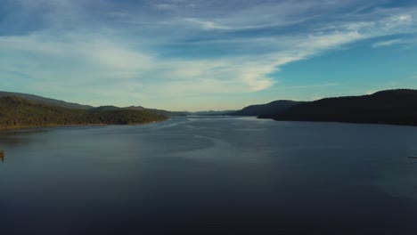 Scenic-View-Of-A-Lake-Against-Sky-At-Sunset---drone-shot