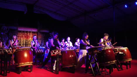 Taiko-Japanese-Percussion-Musical-Group-Plays-Drums-Onstage-at-Night-Japan-Music