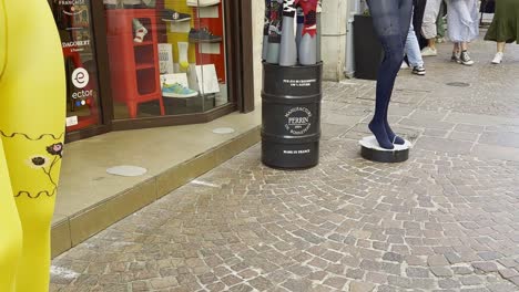 Fashion-in-Haute-Savoie,-Annecy-with-female-pedestrians-walking-on-cobbled-street