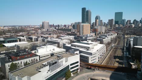 Aerial-Boom-Shot-Reveals-Northeastern-University-Campus,-Boston-Skyscrapers