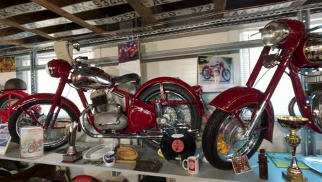 Milzkalne,-Latvia---June-11,-2023:-Vintage-Classic-American-Car-and-Extensive-Collection-of-Jawa-Motorcycle,-Soviet-Moto-Equipment-Garage-Exhibited-in-the-Automobile-Motor-Museum-Located-in-Milzkalne