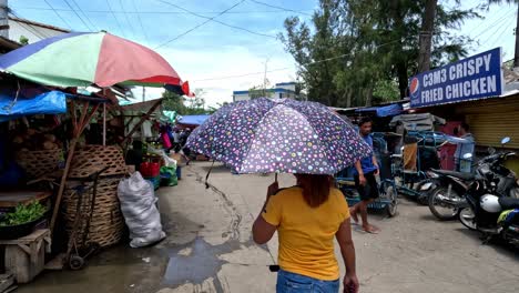 People-Walking-Along-a-Narrow-and-Busy-Street-next-to-a-Public-Market-in-Danao-City,-Cebu,-Philippines