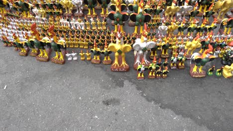As-part-of-the-offering-area,-many-chicken-models-as-offering-to-Ai-Khai,-the-legendary-holy-child-boy-at-Wat-Chedi-or-The-Pagoda-Temple