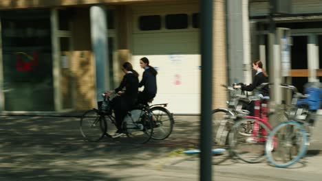 Young-Orthodox-Jewish-girls-biking-in-the-famous-Antwerp's-diamond-district---Belgium