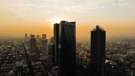 Aerial-view-approaching-the-Ritz-carlton-hotel,-sunset-in-downtown-Mexico-city