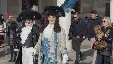 Venice,-Italy,-February-13-2023-During-carnival-people-dress-in-costumes-and-mask-and-enjoy-walking-in-crowded-streets-between-tourist