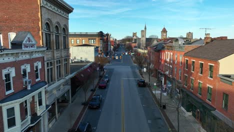 Drone-view,-aerial-dolly-forward-over-a-main-street-in-small-town-America