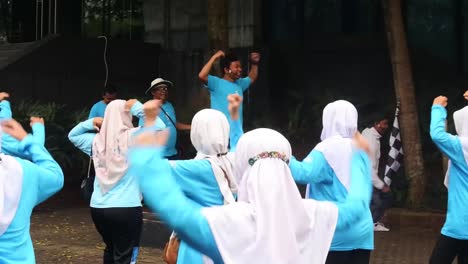 Residents-do-morning-exercises-during-car-free-day-in-Central-Jakarta,-Indonesia