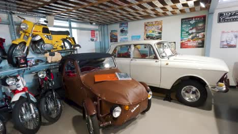 Milzkalne,-Latvia---June-11,-2023:-Vintage-Classic-American-Car-and-Extensive-Collection-of-Jawa-Motorcycle,-Soviet-Moto-Equipment-Garage-Exhibited-in-the-Automobile-Motor-Museum-Located-in-Milzkalne