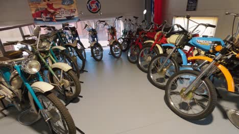 Milzkalne,-Latvia---June-11,-2023:-Vintage-Classic-American-Car-and-Extensive-Collection-of-Jawa-Motorcycle,-Soviet-Moto-Equipment-Garage-Exhibited-in-the-Automobile-Motor-Museum-Located-in-Milzkalne